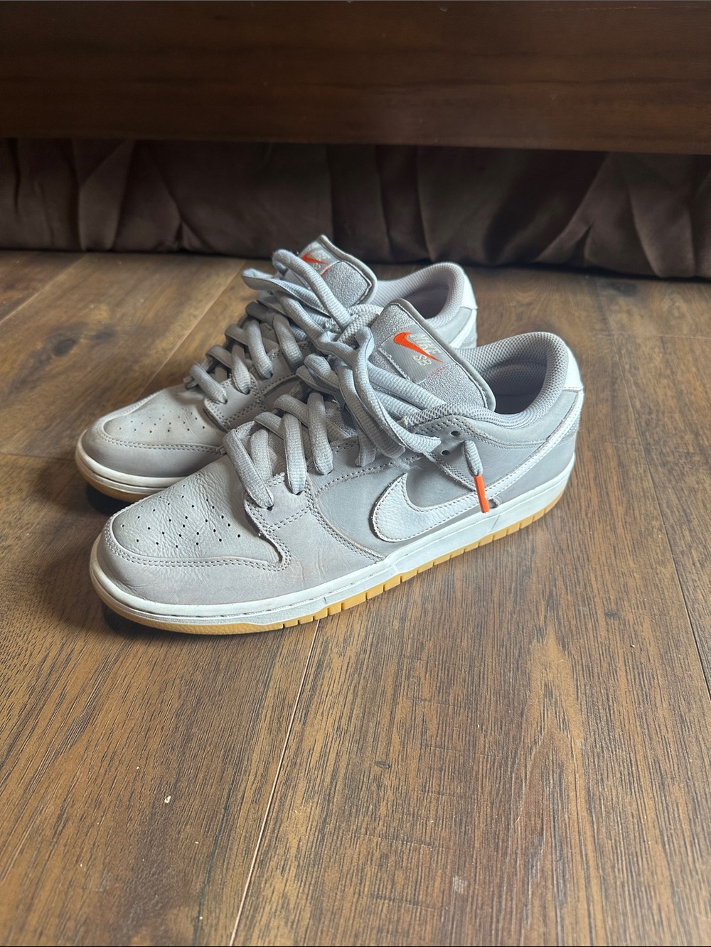 Nike Men's Light Gray Suede Low-Top Sneakers with Orange Accents